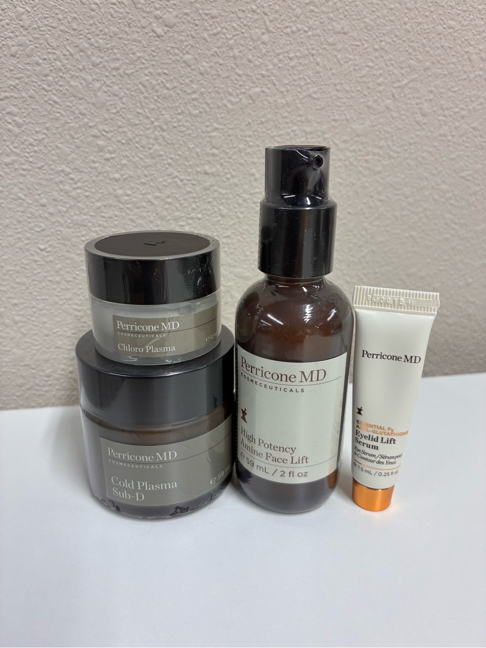 Perricone MD Skincare Set in Brown, Cream, Black and Gold Accents
